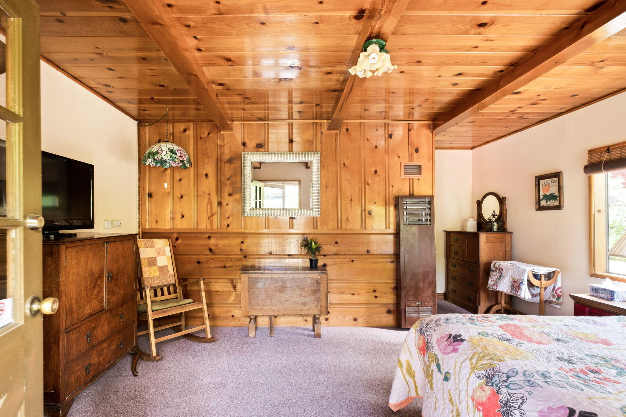 25210 Fern Valley Road Idyllwild, CA 92549 - Photo 75 of 127 a bedroom with a bed and wooden floor