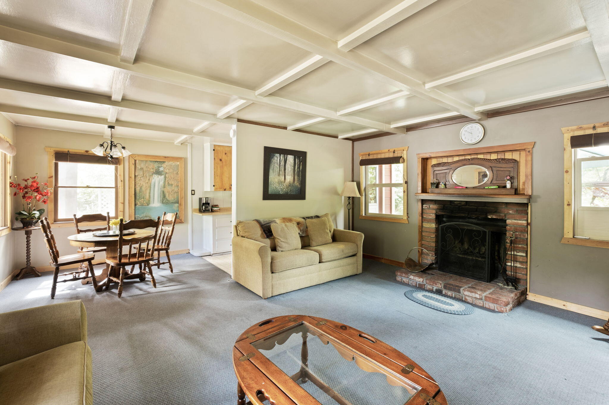 25210 Fern Valley Road Idyllwild, CA 92549 - Photo 86 of 127 a living room with furniture a fireplace and a window
