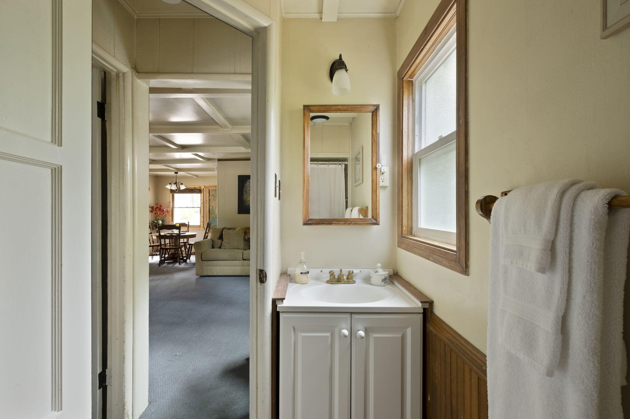 25210 Fern Valley Road Idyllwild, CA 92549 - Photo 89 of 127 a en suite bathroom with a granite countertop sink and a mirror