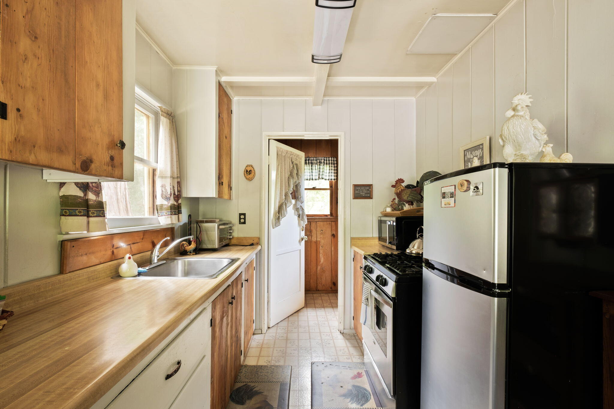 25210 Fern Valley Road Idyllwild, CA 92549 - Photo 90 of 127 a kitchen with a refrigerator a sink and dishwasher