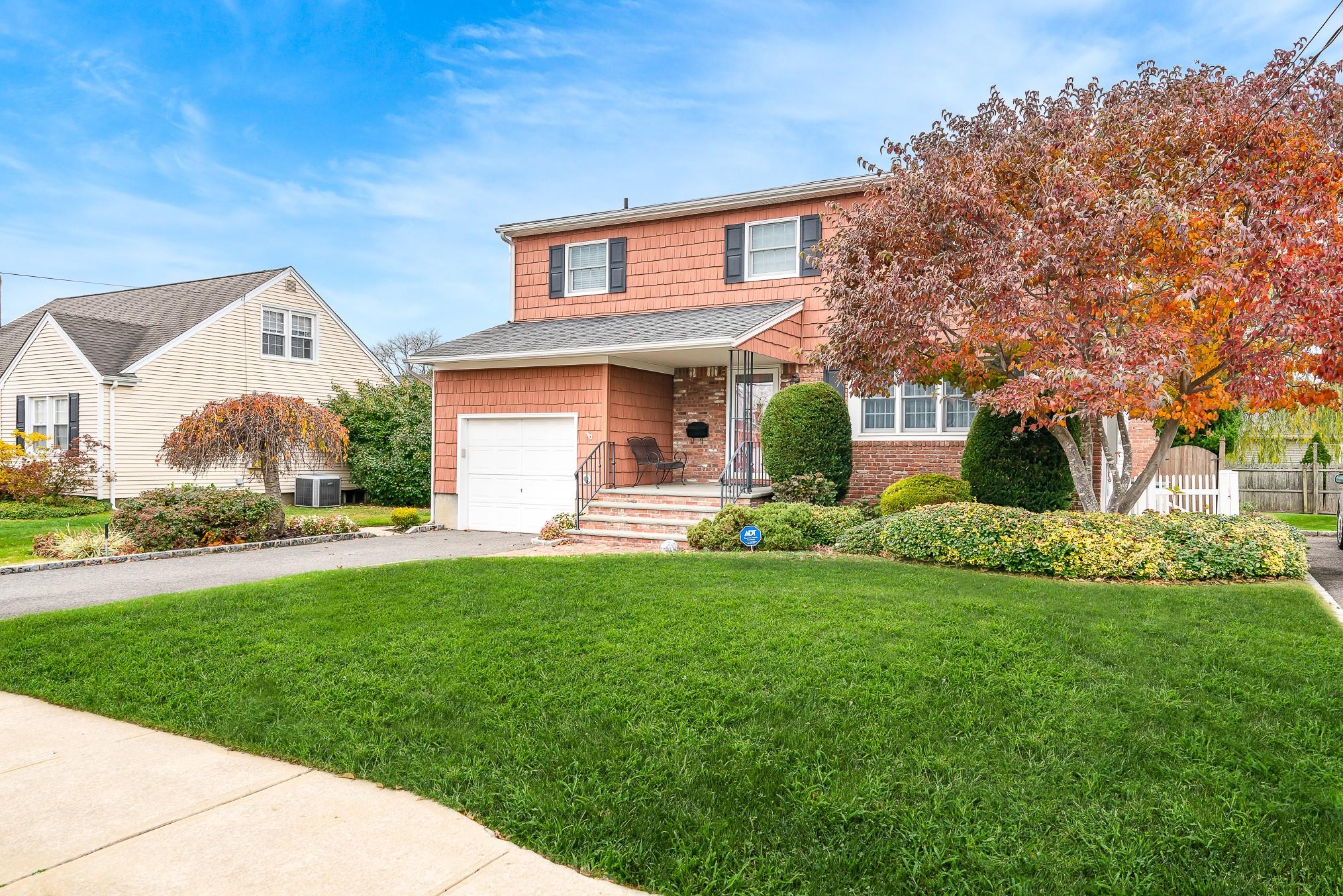 2084 Pine Street Wantagh, NY 11793 - Photo 1 of 1 a front view of a house with garden