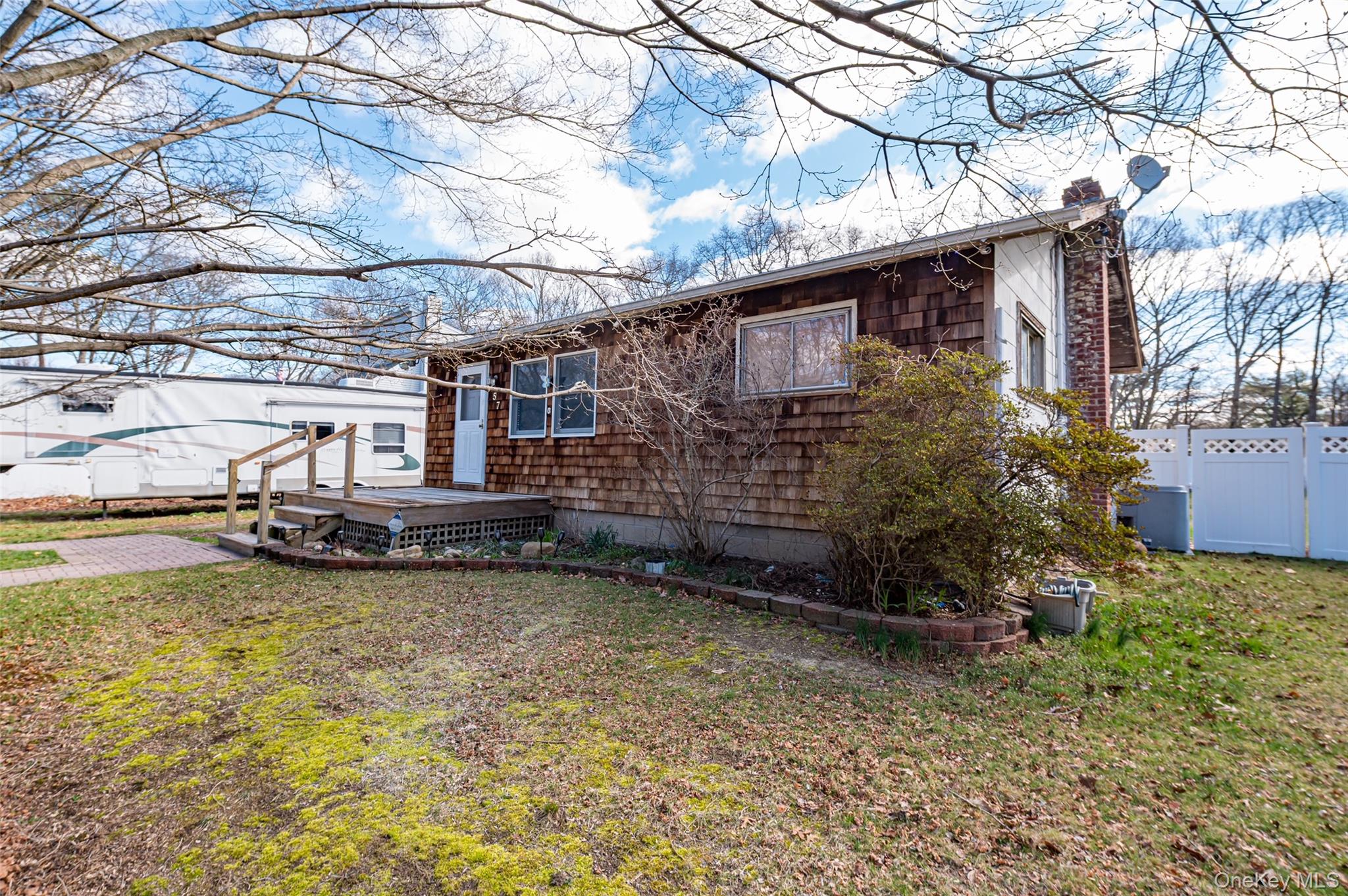 157 Hawthorne Street Mastic, NY 11950 - Photo 3 of 12 a view of a house with a yard