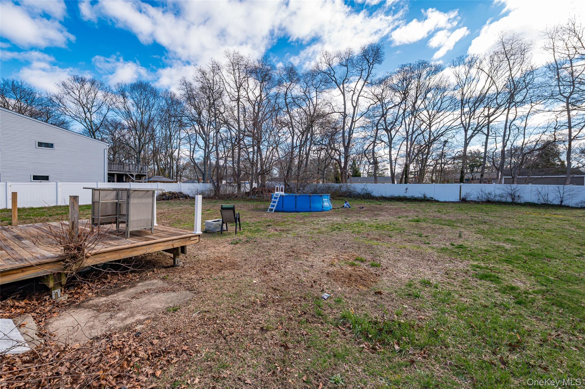 157 Hawthorne Street Mastic, NY 11950 - Photo 4 of 12 a view of a house with a yard
