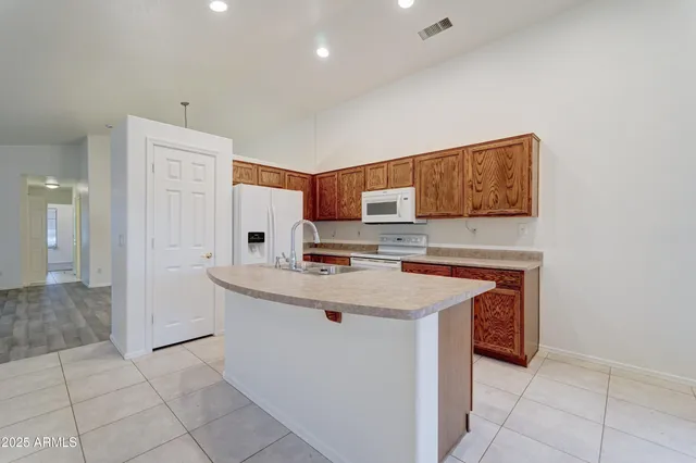a kitchen with stainless steel appliances granite countertop a sink and cabinets