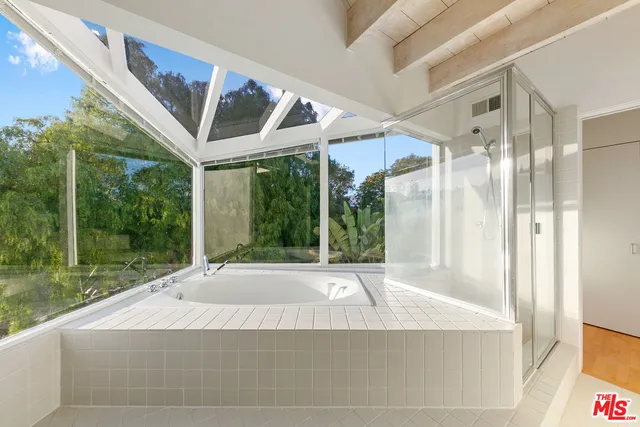 a view of a house with a porch and a yard