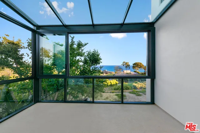 a view of a room with window and outdoor view