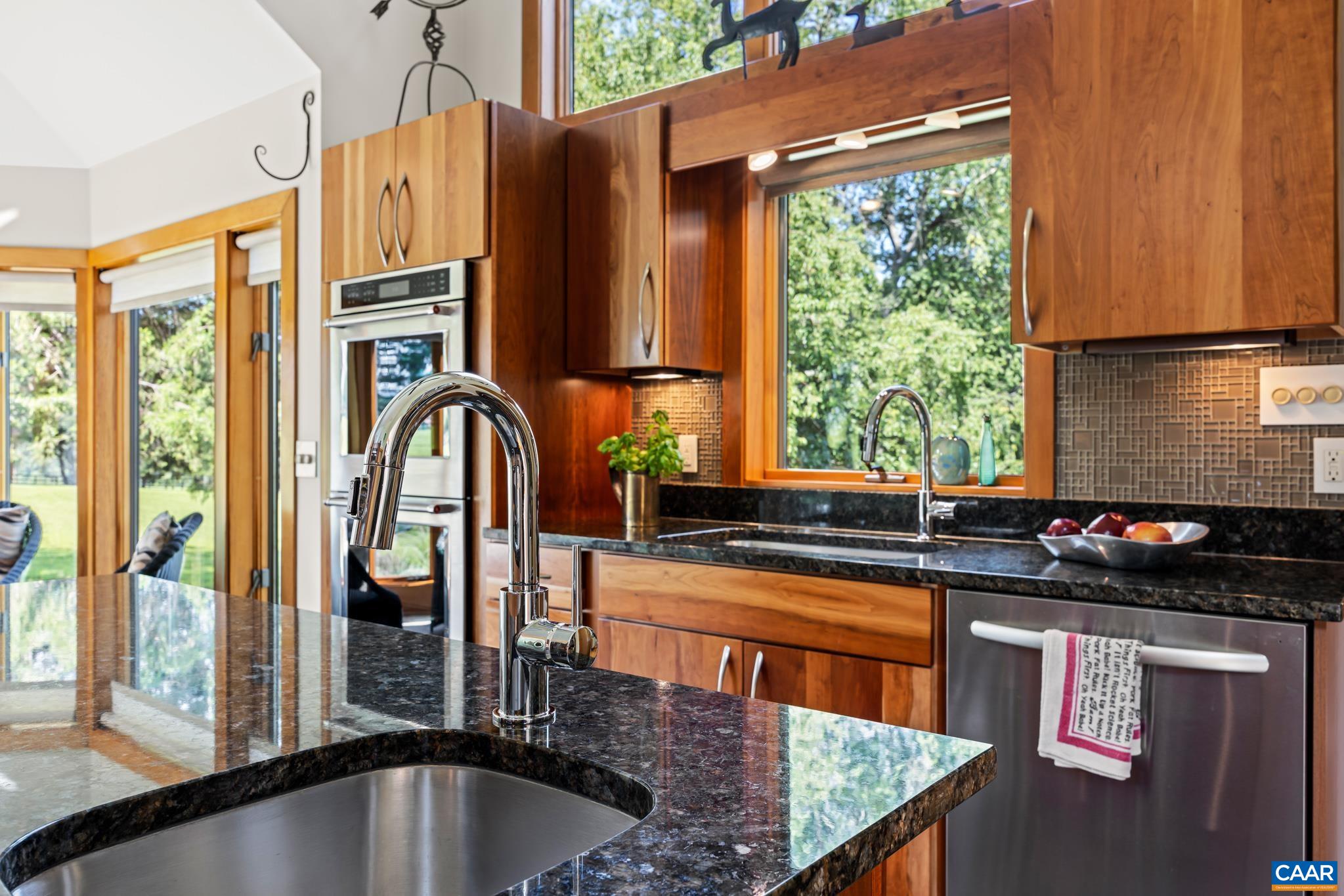 456 Roberts Mountain Road Faber, VA 22938 - Photo 19 of 59 a kitchen with stainless steel appliances granite countertop a sink a stove and a refrigerator