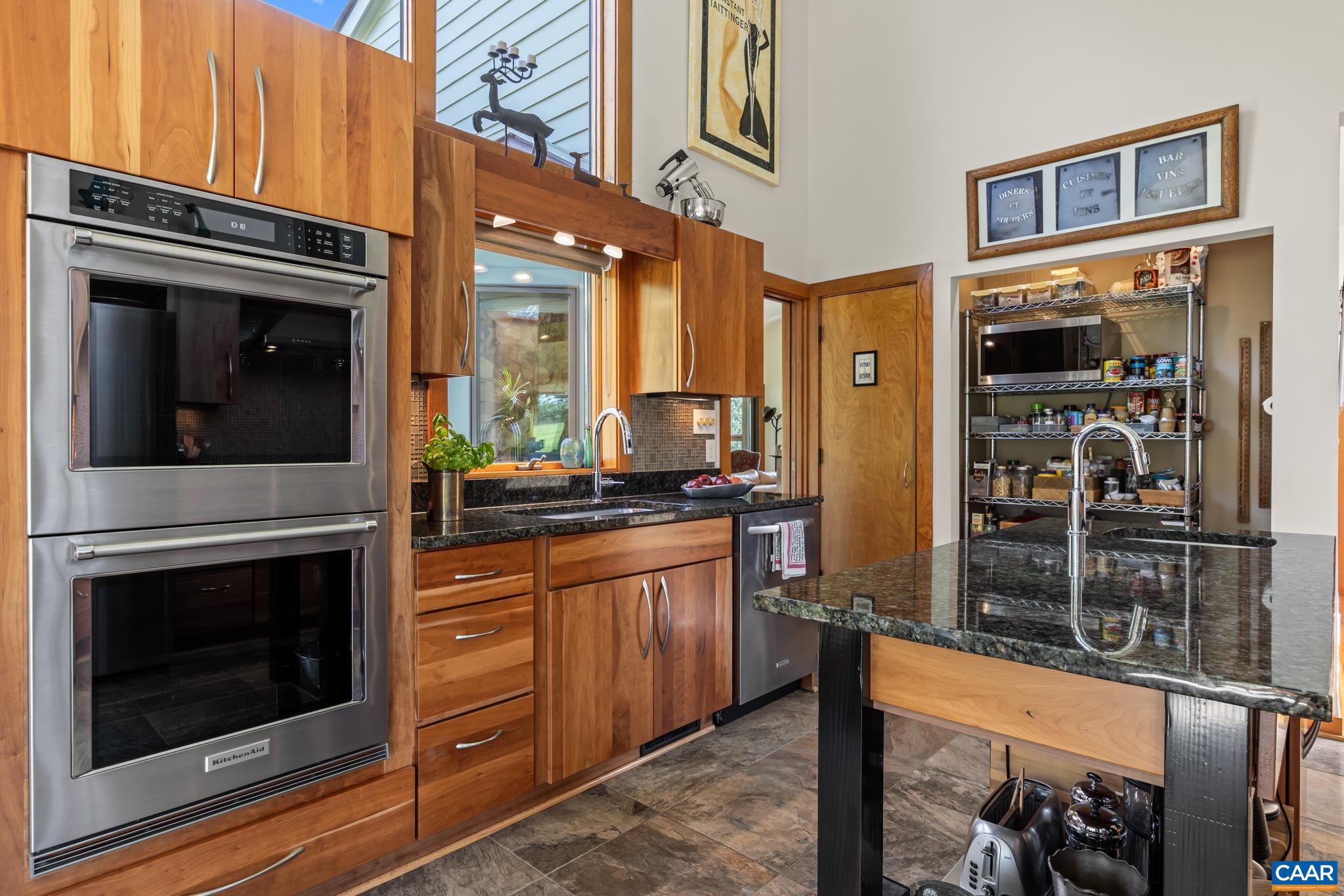 456 Roberts Mountain Road Faber, VA 22938 - Photo 20 of 59 a kitchen with stainless steel appliances granite countertop a stove and a refrigerator