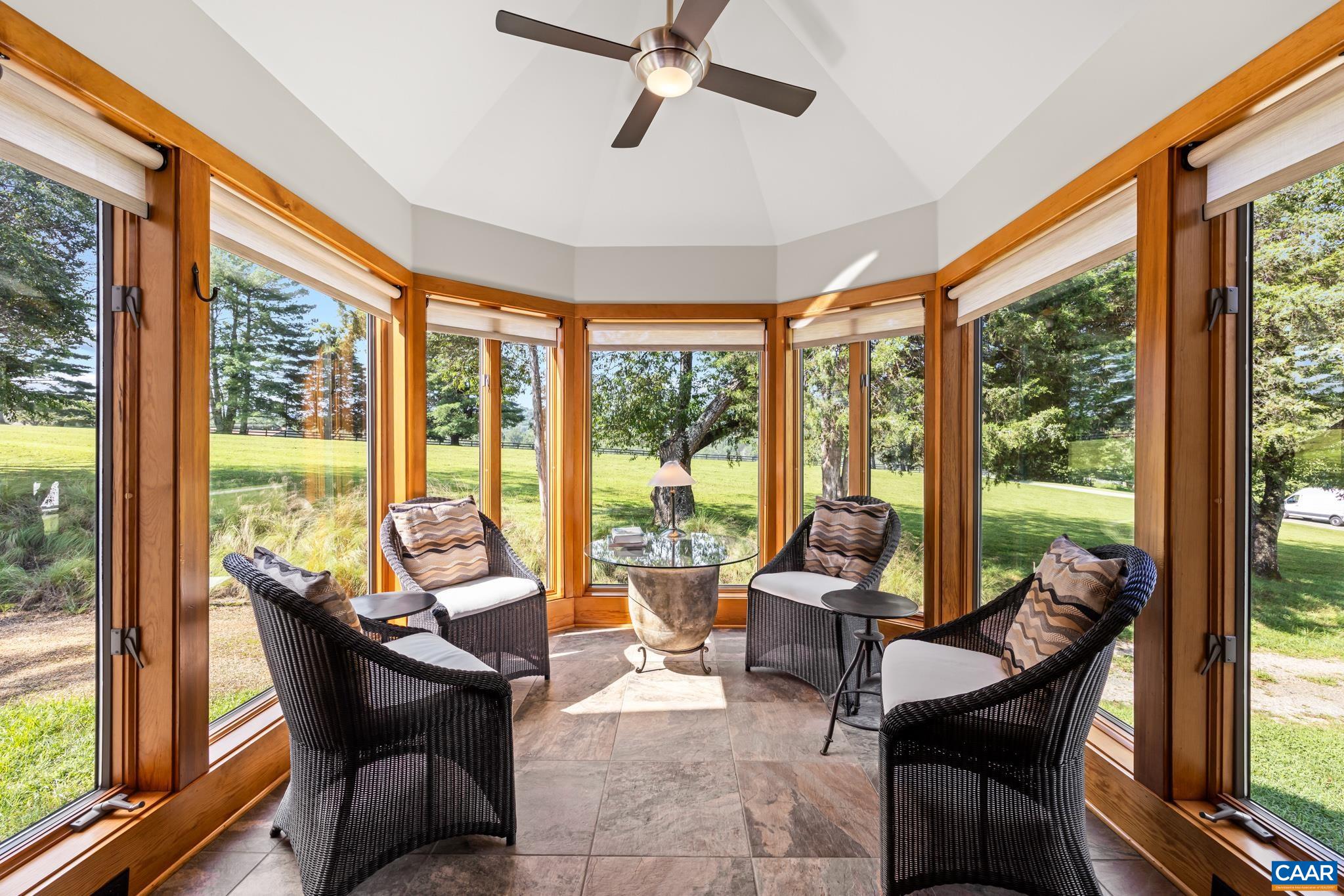 456 Roberts Mountain Road Faber, VA 22938 - Photo 21 of 59 a living room with furniture and floor to ceiling windows