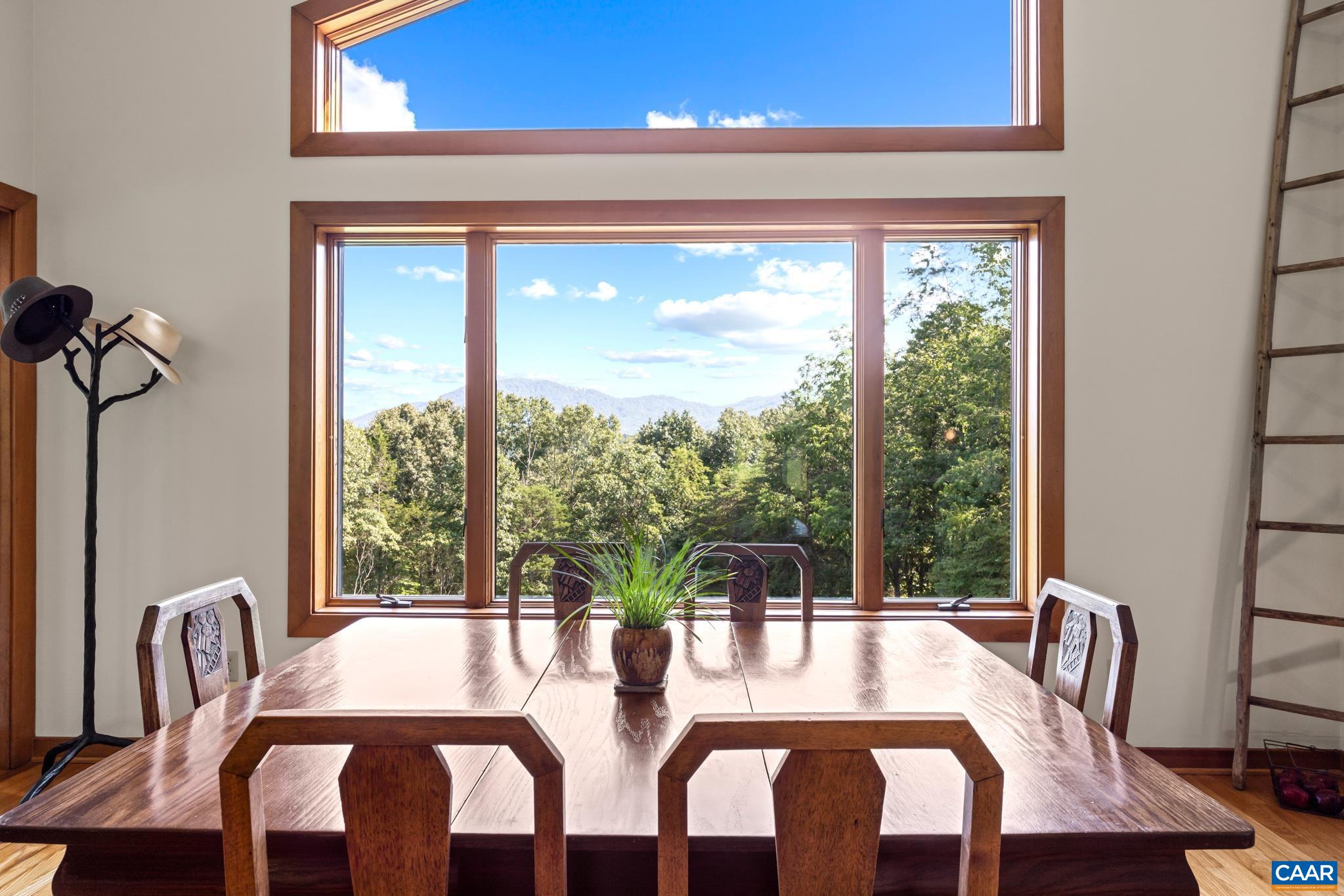 456 Roberts Mountain Road Faber, VA 22938 - Photo 25 of 59 a view of a city from a dining room with furniture and window