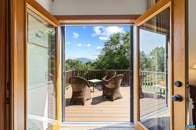 a bedroom with a bed a table and chair