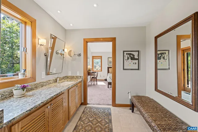 a kitchen that has a lot of cabinets in it and wooden floor
