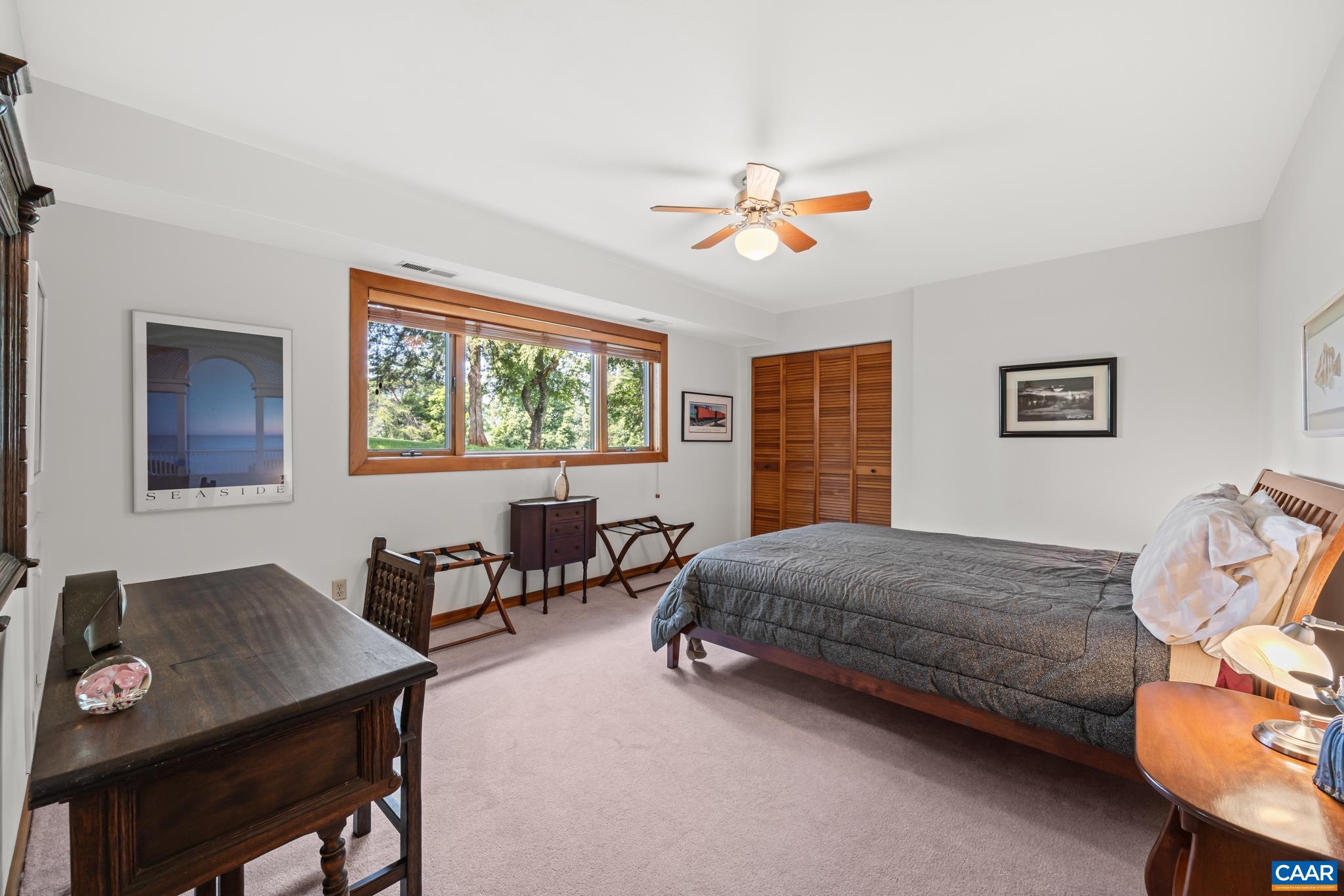 456 Roberts Mountain Road Faber, VA 22938 - Photo 40 of 59 a living room with a bed furniture and a window