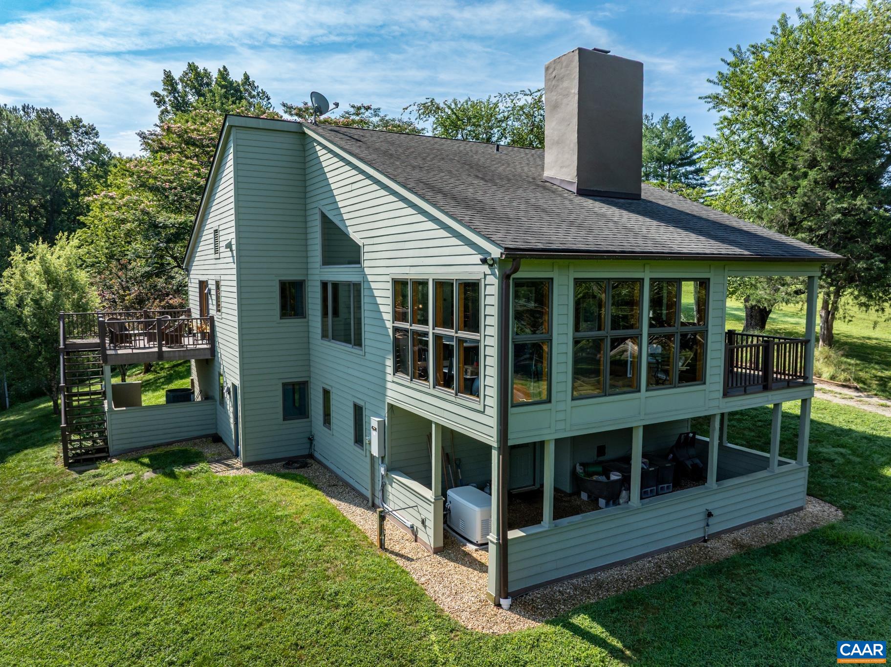 456 Roberts Mountain Road Faber, VA 22938 - Photo 4 of 59 a view of house with backyard outdoor seating and green space