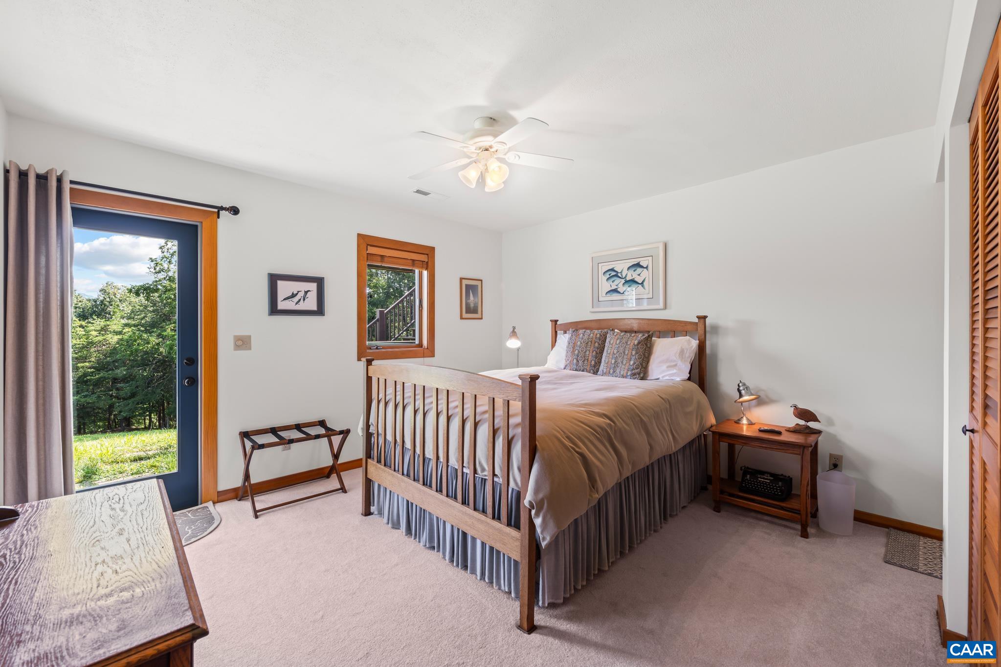 456 Roberts Mountain Road Faber, VA 22938 - Photo 43 of 59 a spacious bedroom with a bed and a window