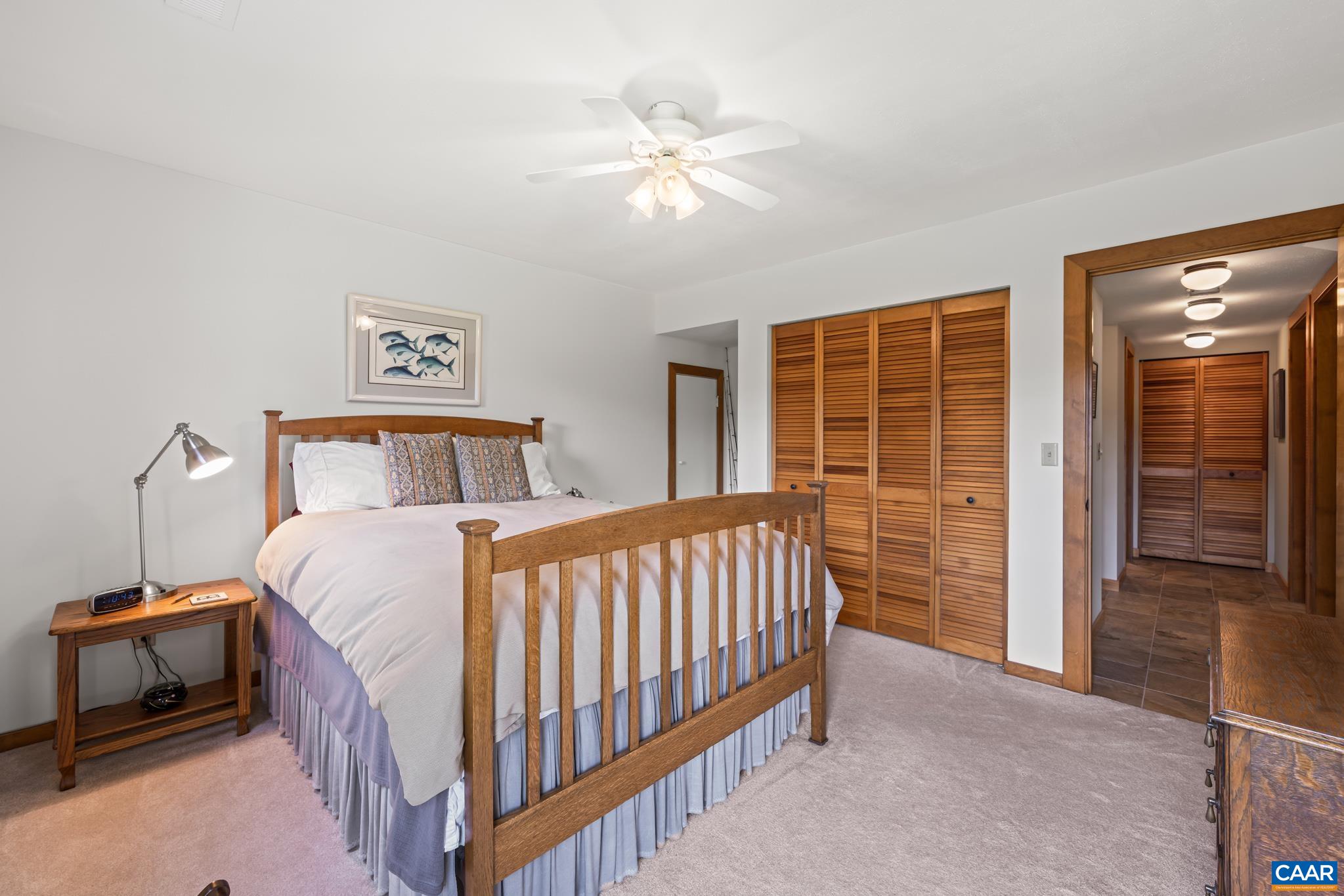 456 Roberts Mountain Road Faber, VA 22938 - Photo 44 of 59 a bedroom with a bed and a large window