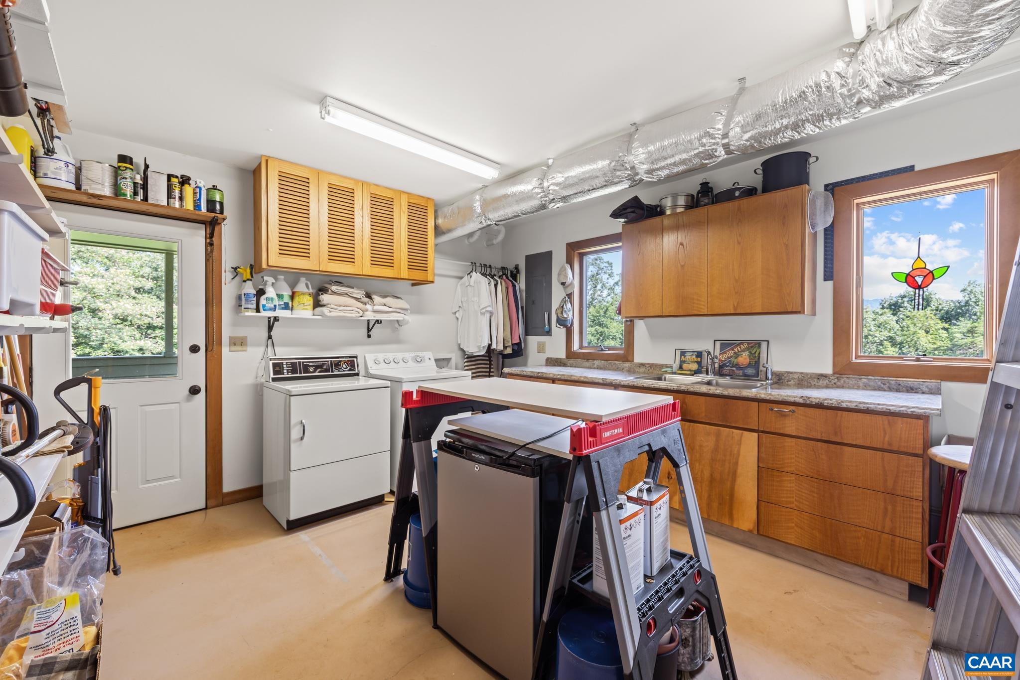 456 Roberts Mountain Road Faber, VA 22938 - Photo 45 of 59 a kitchen that has a lot of cabinets in it and wooden floor