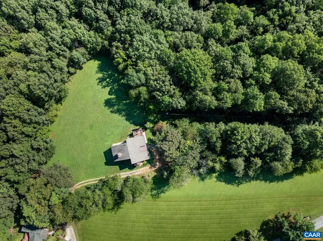 an aerial view of a house with a garden