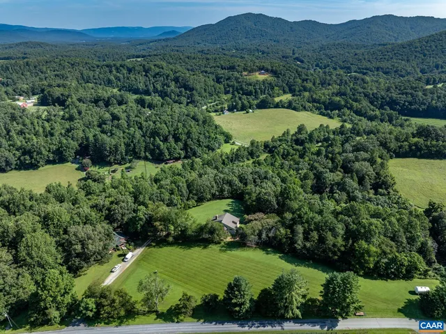 an aerial view of residential house with outdoor space