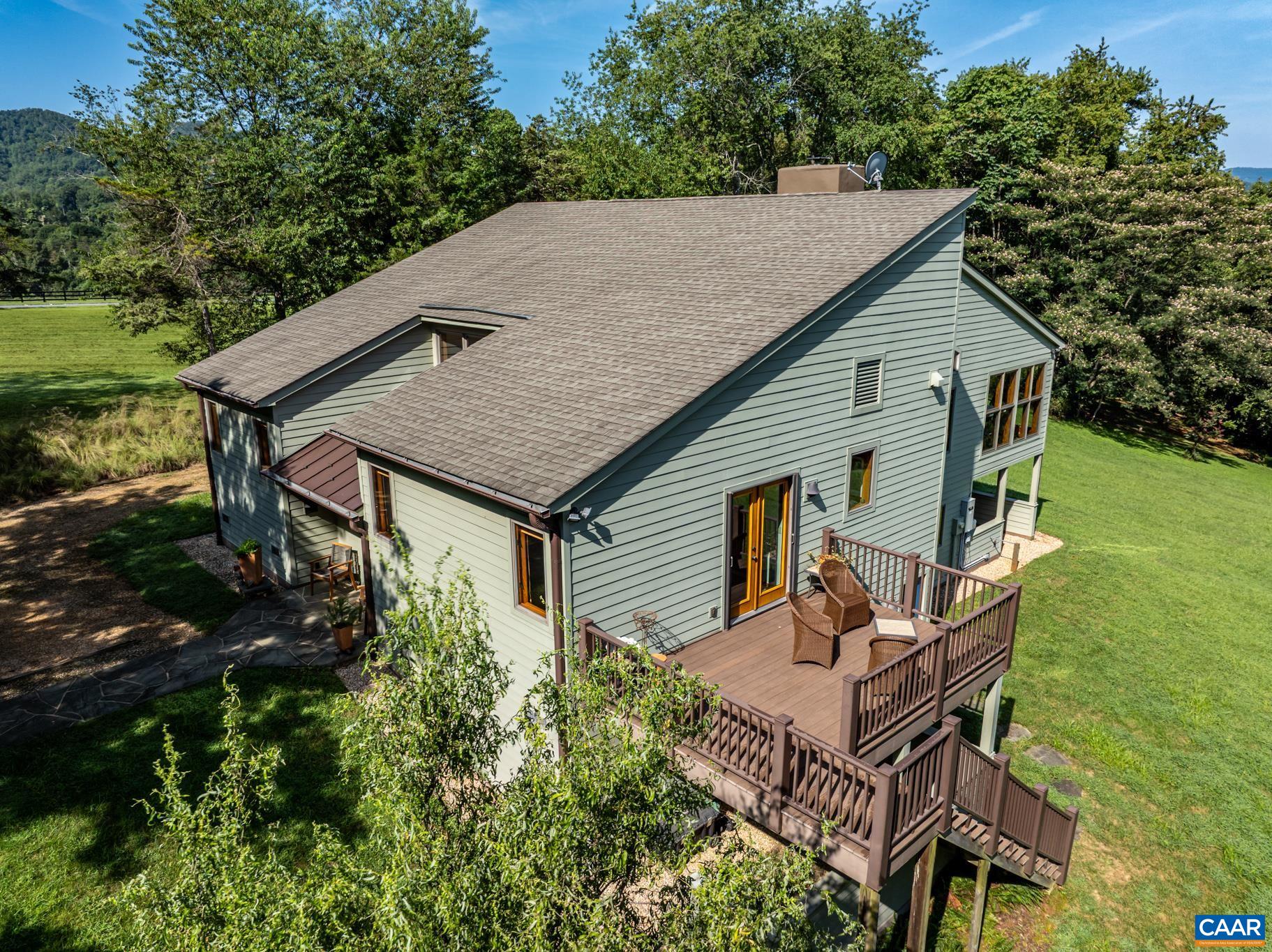 456 Roberts Mountain Road Faber, VA 22938 - Photo 6 of 59 a backyard of a house with table and chairs