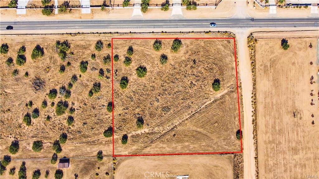0 El Centro Road Oak Hills, CA 92344 - Photo 13 of 16 a bathroom with a shower curtain and a sink