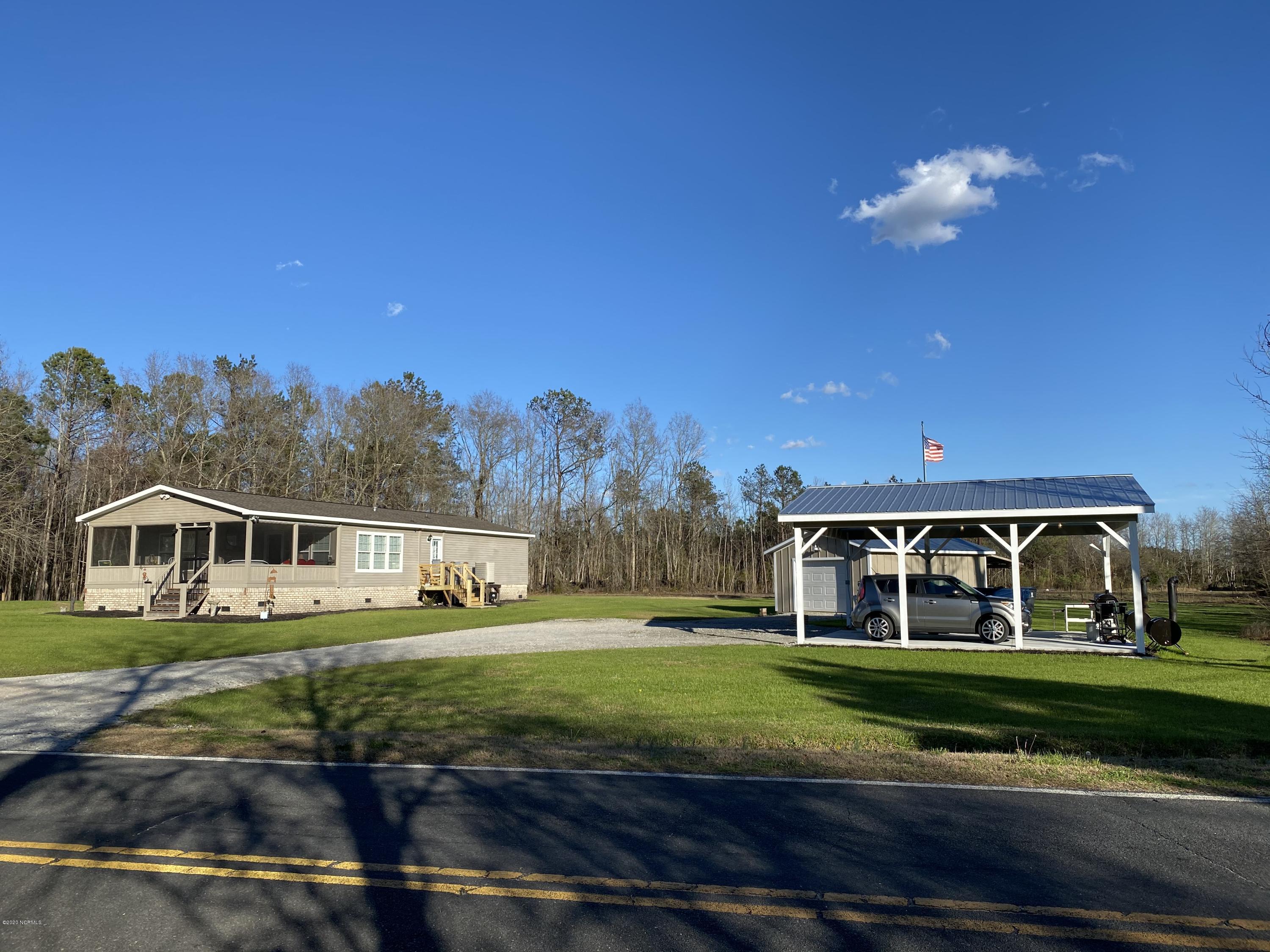 7022 Kingtown Road Northwest Ash, NC 28420 - Photo 1 of 34 2016 Schult Manufactured Home has 3BD/2BA, brick under pinned and is on over 1.5+/- acres. There is a detached one car garage with a wood stove and a double carport, with a concrete pad and attic storage.