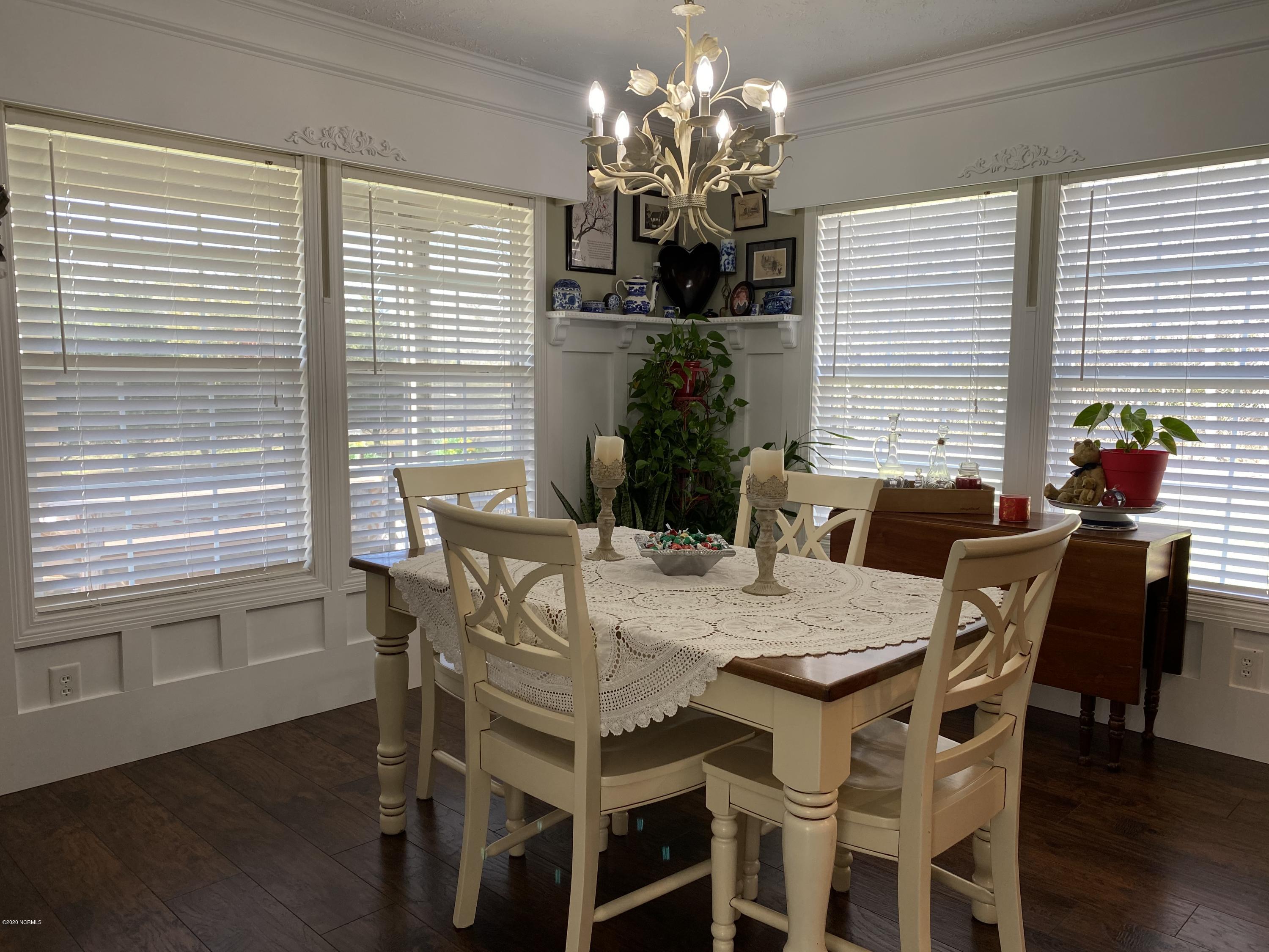 7022 Kingtown Road Northwest Ash, NC 28420 - Photo 12 of 34 Custom cornices are on the dining area windows.