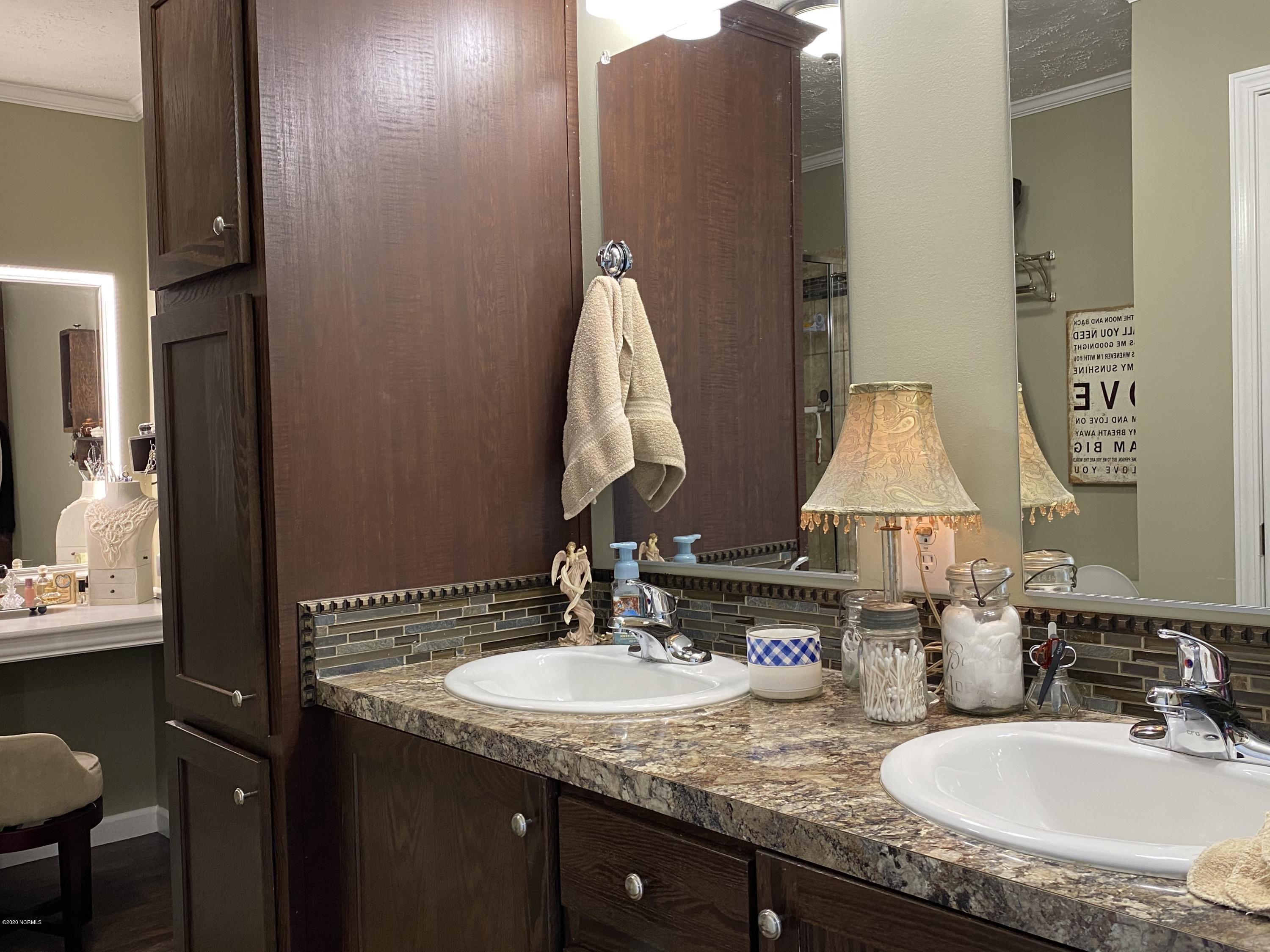 7022 Kingtown Road Northwest Ash, NC 28420 - Photo 19 of 34 Double vanity in the spacious Owners Suite Bathroom