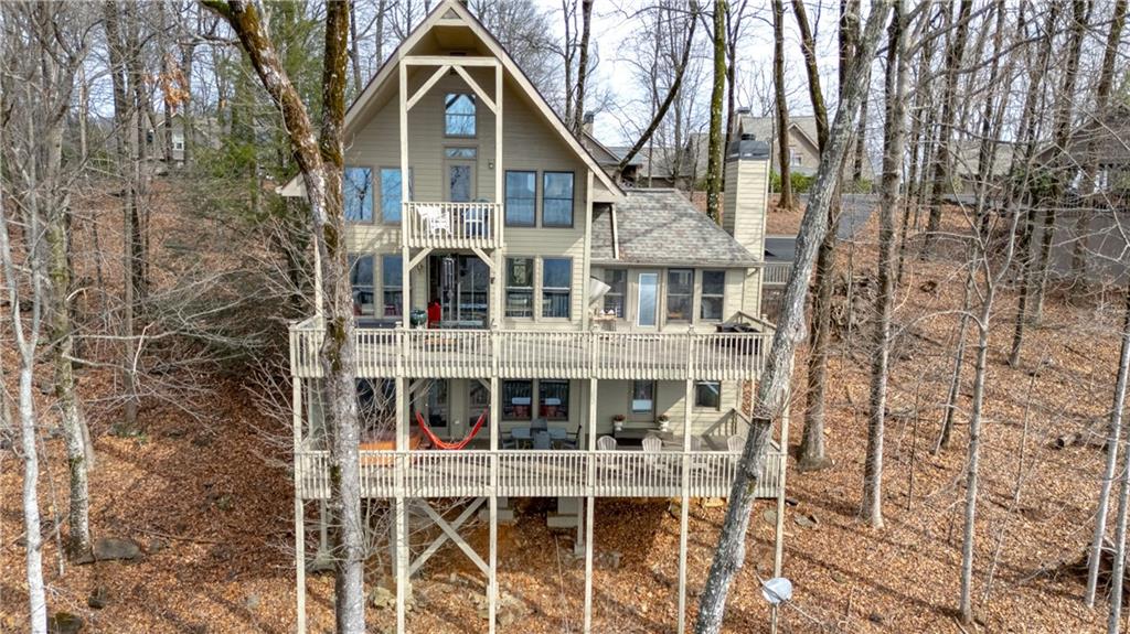 1911 Ridgeview Drive Jasper, GA 30143 - Photo 53 of 65 a view of a brick house with large windows and large trees