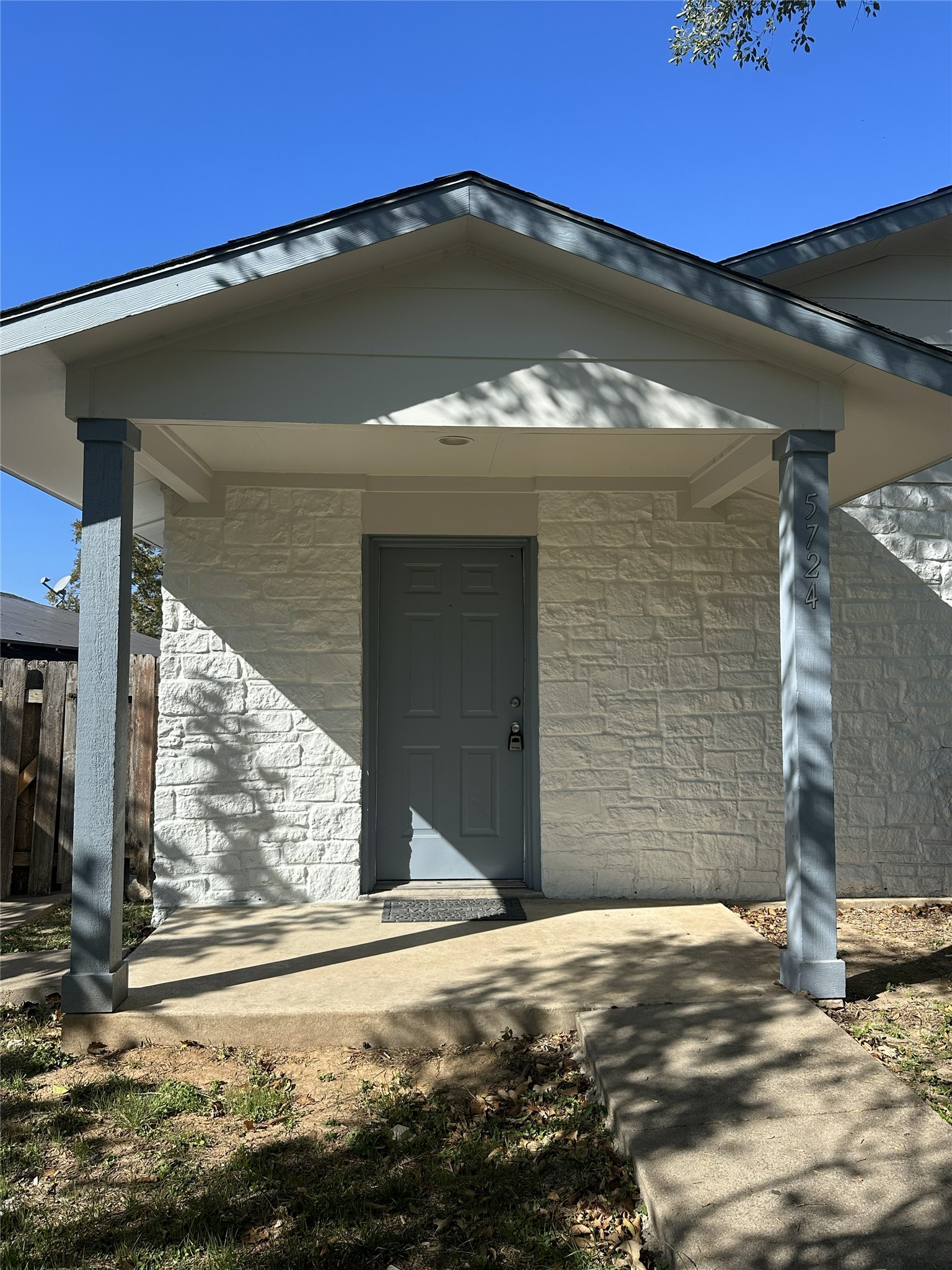 5724 Signal Point Austin, TX 78724 - Photo 2 of 17 View of exterior entry featuring stone siding