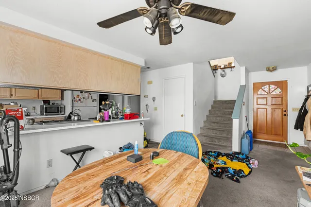 a bedroom with bed and a chandelier