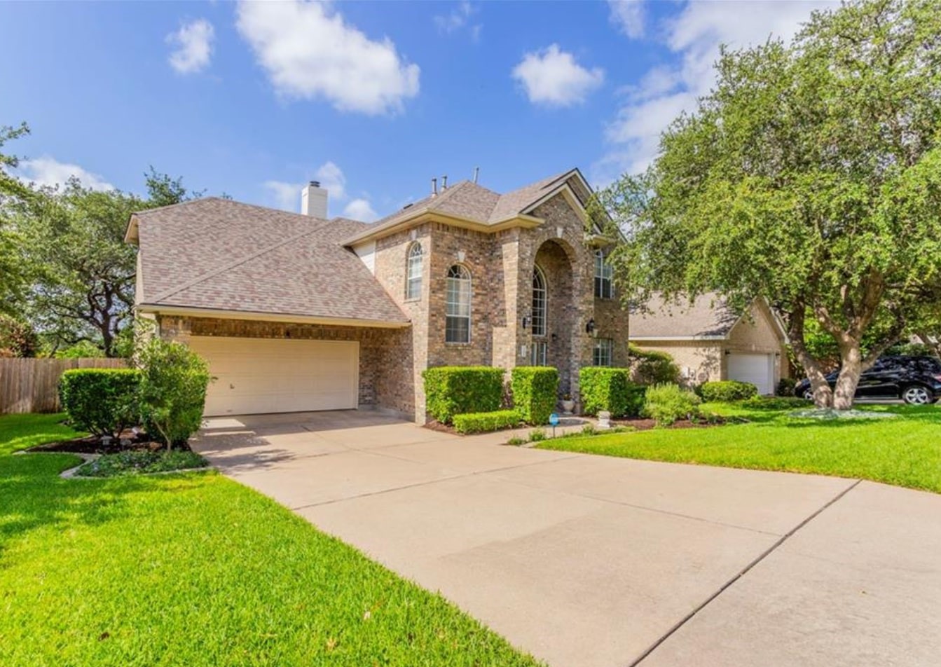 1100 Antelope Ridge Cedar Park, TX 78613 - Photo 2 of 24 a front view of a house with a yard and garage