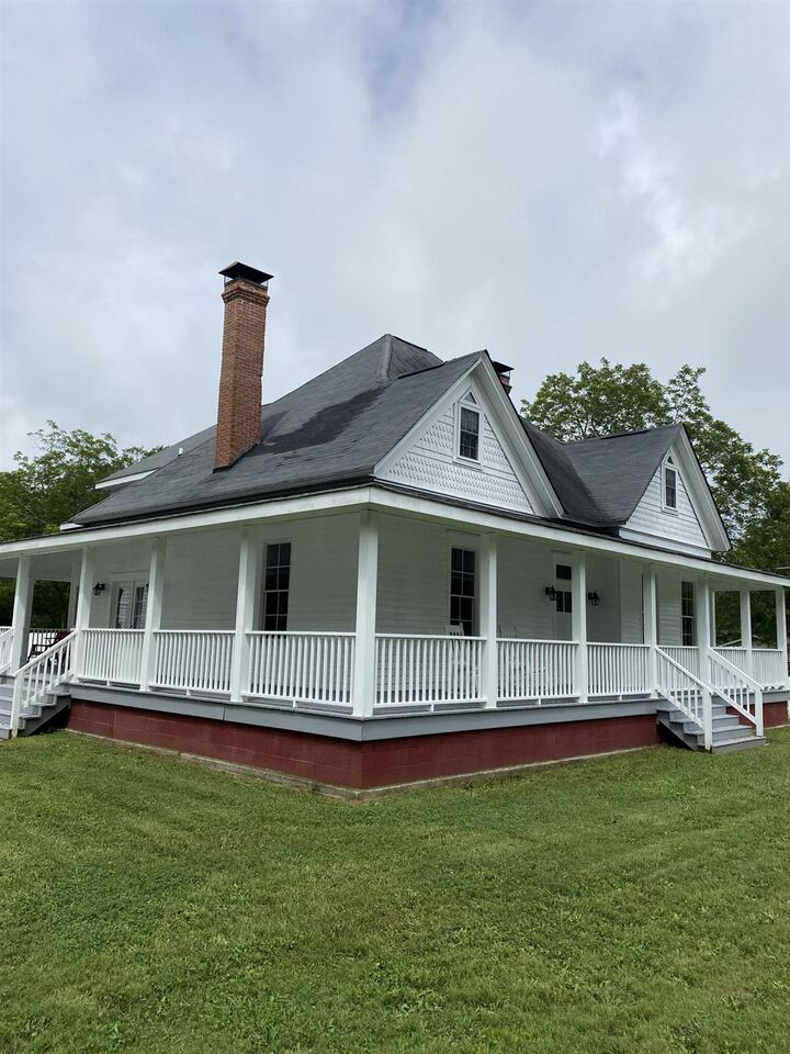 7969 Fayetteville Road Fairburn, GA 30213 - Photo 1 of 1 a front view of a house with a garden