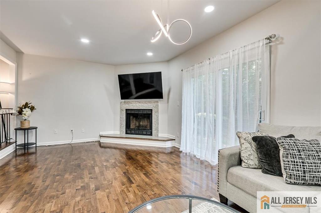 3003 Hana Road Edison, NJ 08817 - Photo 15 of 45 a living room with furniture and a fireplace
