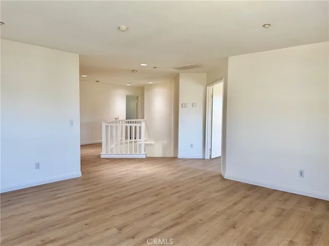 a view of a livingroom with wooden floor
