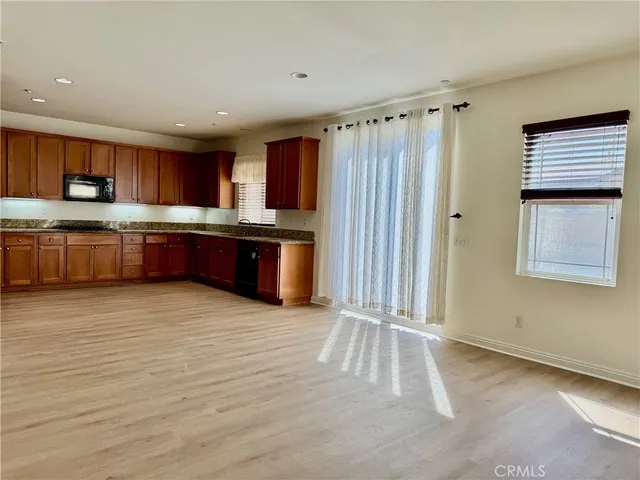 a kitchen with stainless steel appliances granite countertop a granite counter tops and a window
