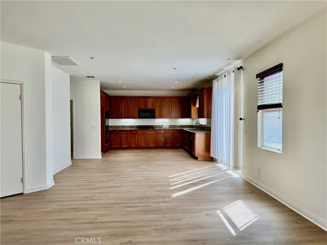 a view of kitchen with wooden floor