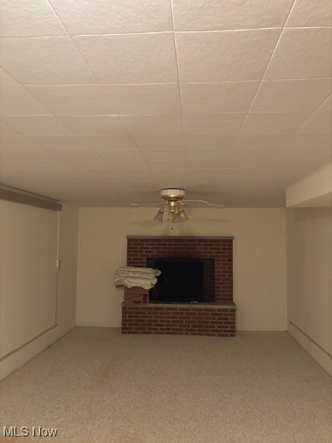 3620 Rambo Avenue Alliance, OH 44601 - Photo 14 of 14 Unfurnished living room with ceiling fan, carpet, and a fireplace