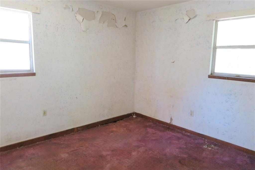 153-UNIT Ranch Road San Mateo, FL 32187 - Photo 22 of 34 an empty room with a window