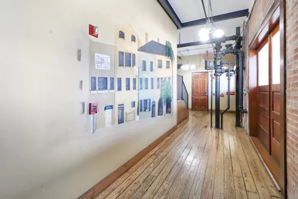 a view of a room with lots of wooden floor