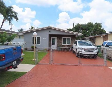 10382 Southwest 25th Street Miami, FL 33165 - Photo 16 of 16 a house view with a garden space