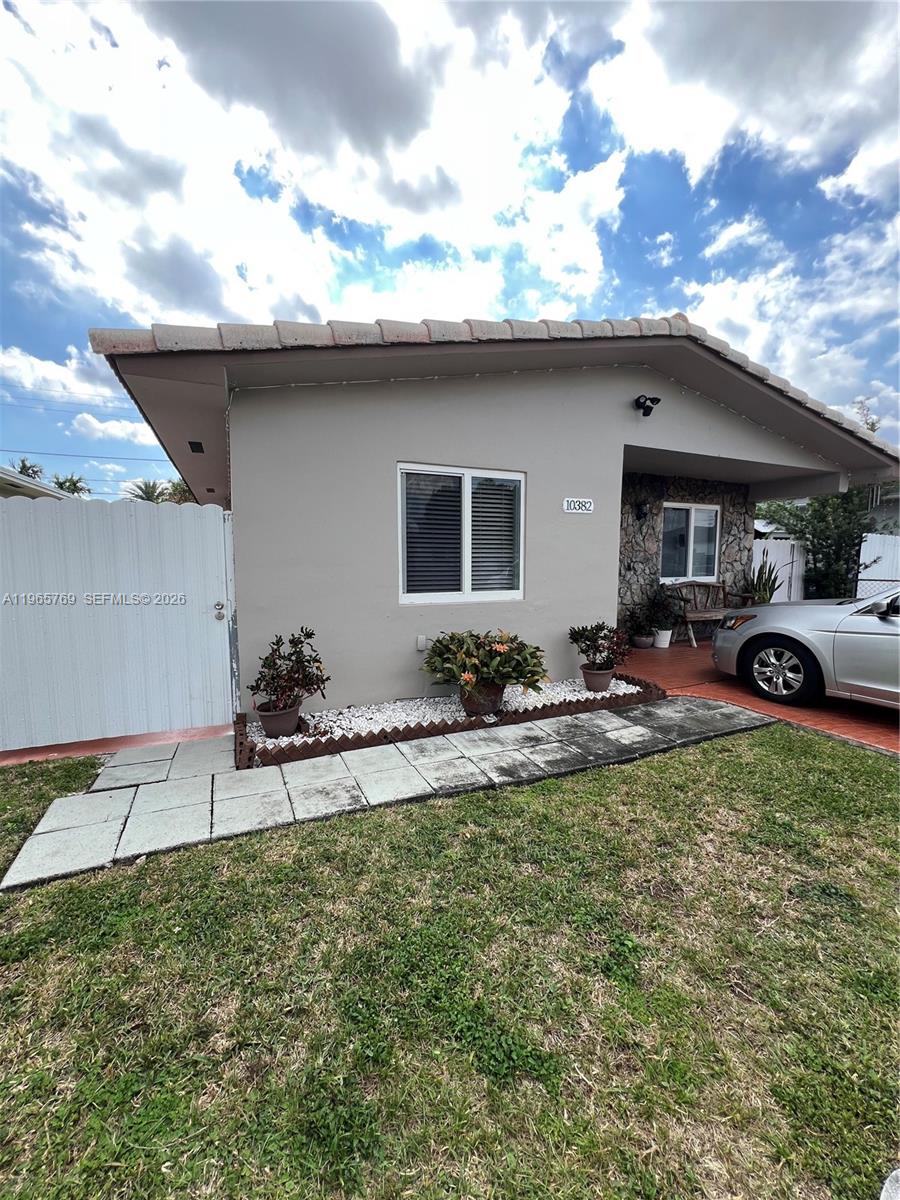 10382 Southwest 25th Street Miami, FL 33165 - Photo 2 of 16 a view of a backyard with a garden and plants