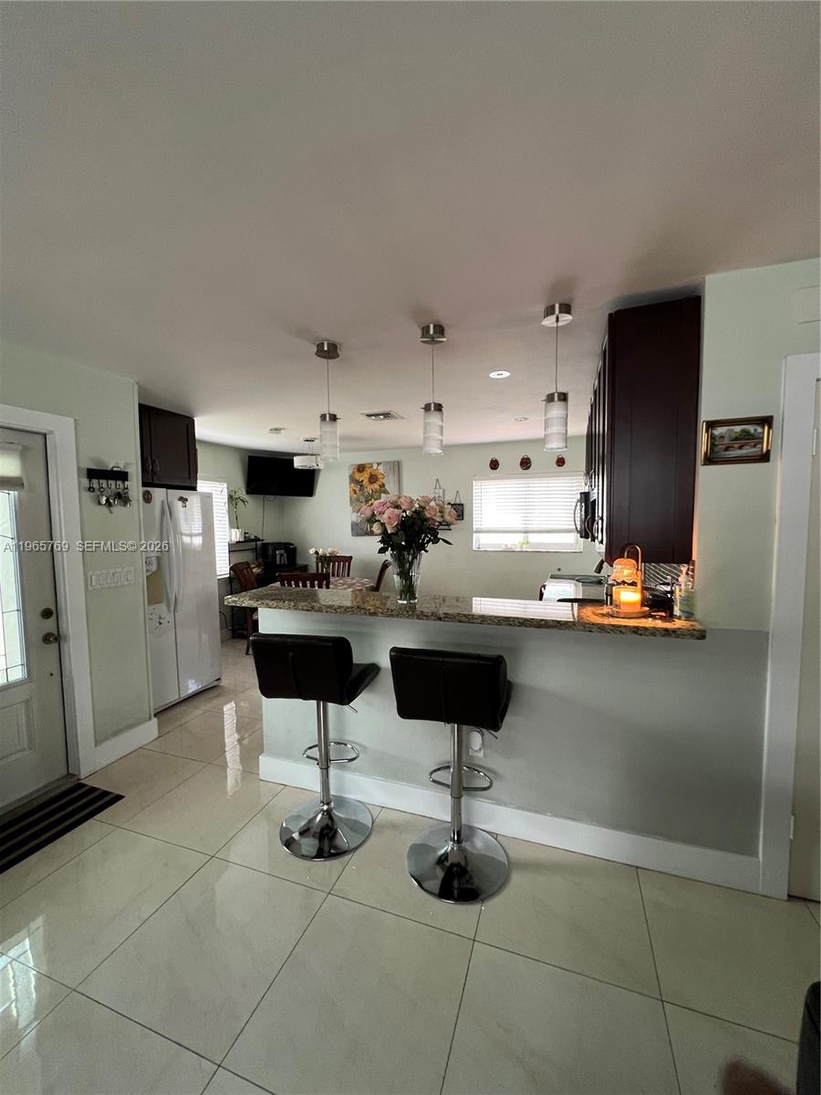 10382 Southwest 25th Street Miami, FL 33165 - Photo 5 of 16 a kitchen with a counter space cabinets and appliances
