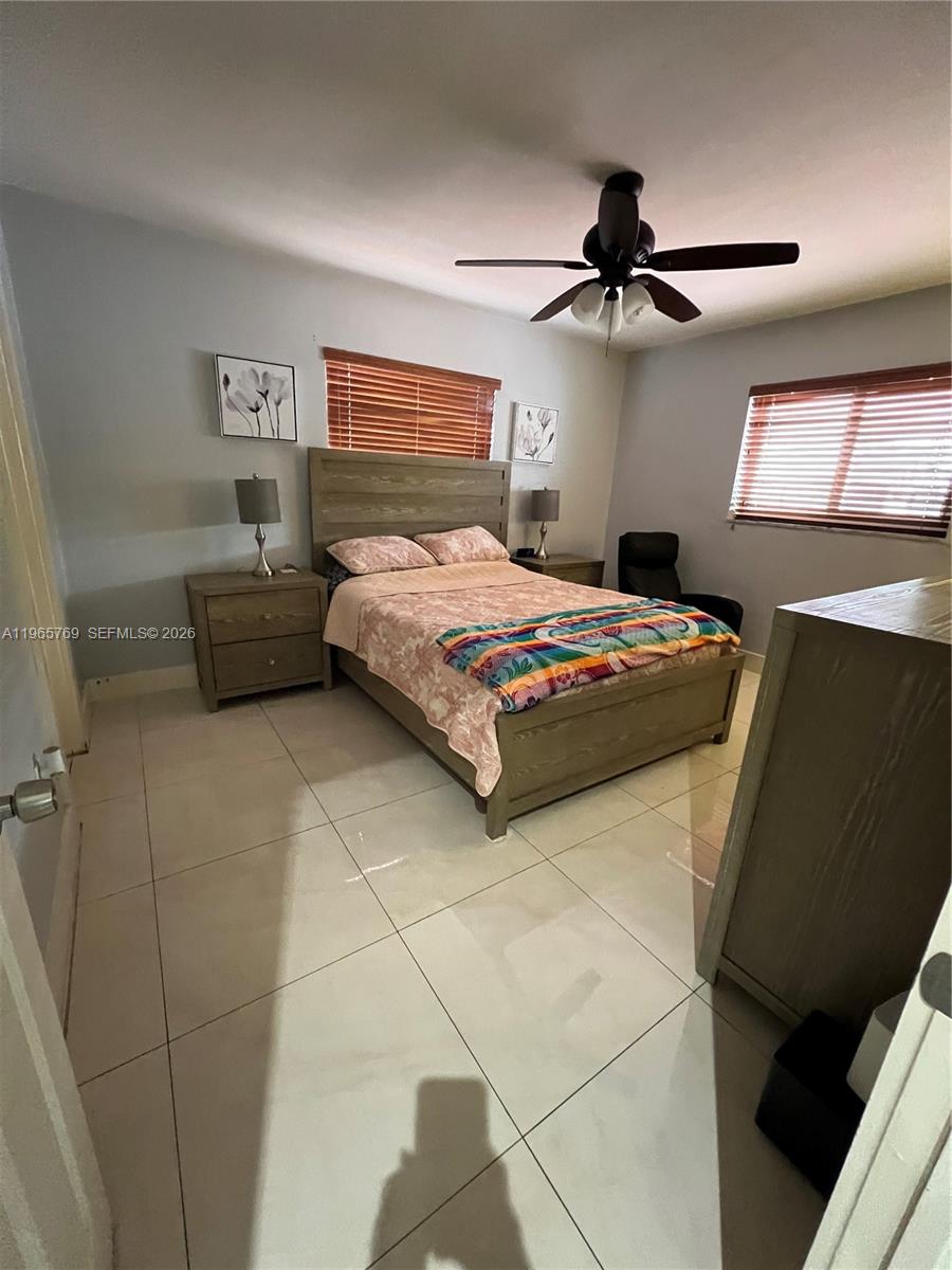 10382 Southwest 25th Street Miami, FL 33165 - Photo 9 of 16 a bedroom with a bed and a dresser