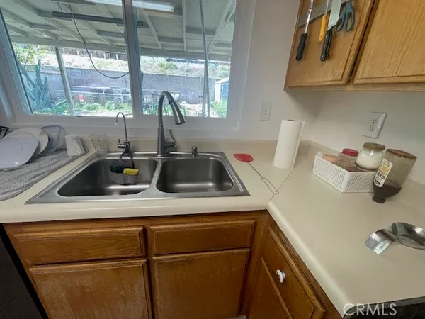 a kitchen with a sink and a refrigerator