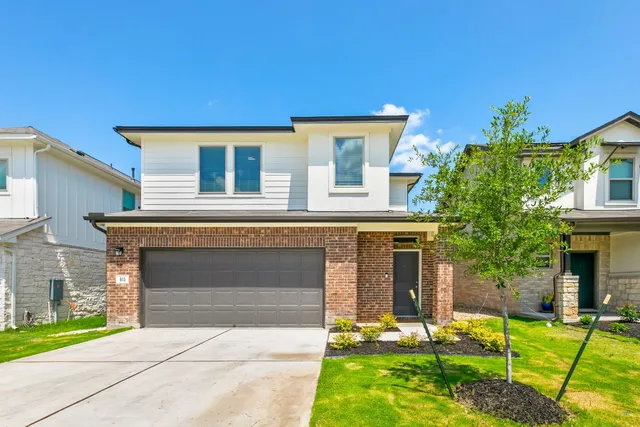 front view of a house with a yard