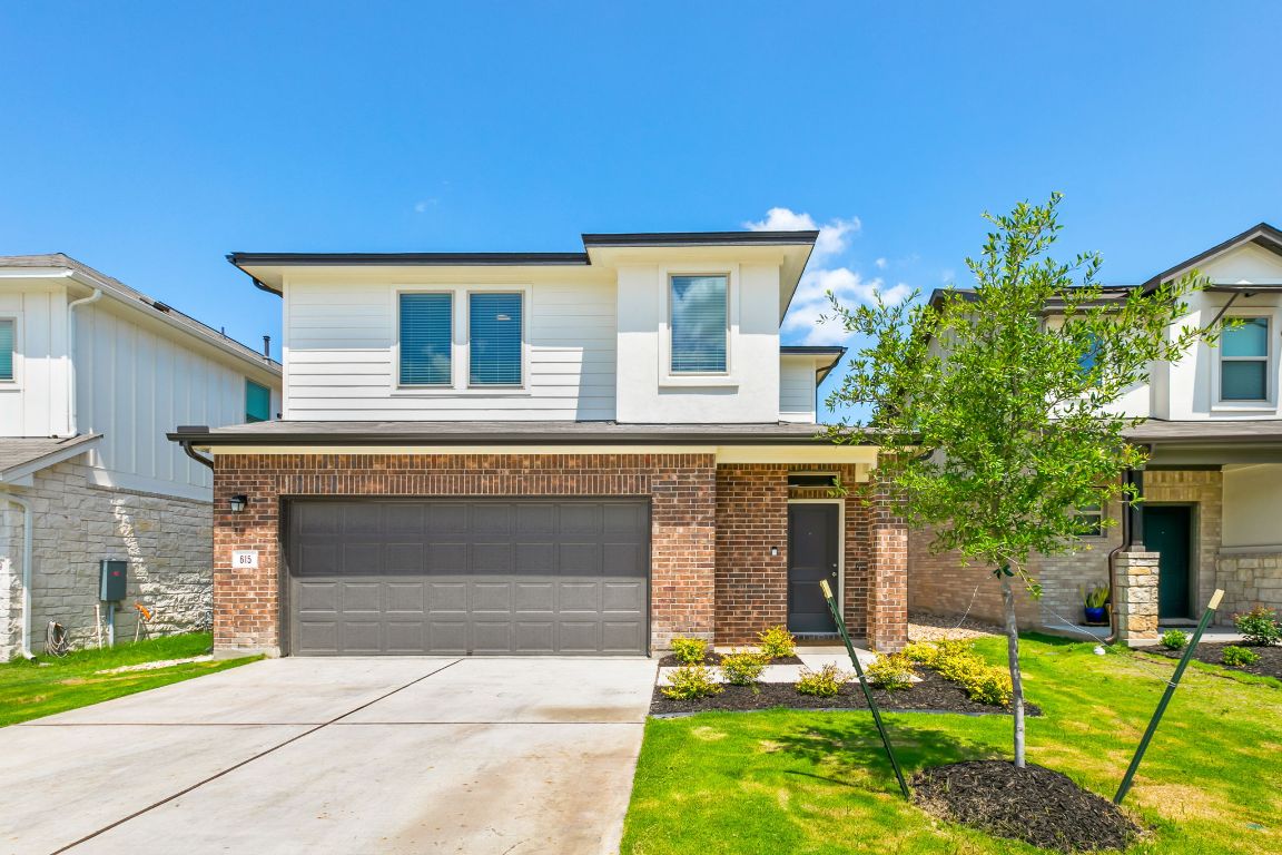 front view of a house with a yard