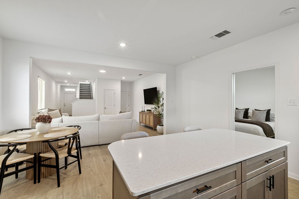 615 Backstays Loop Kyle, TX 78640 - Photo 12 of 36 a living room with furniture a flat screen tv and kitchen view