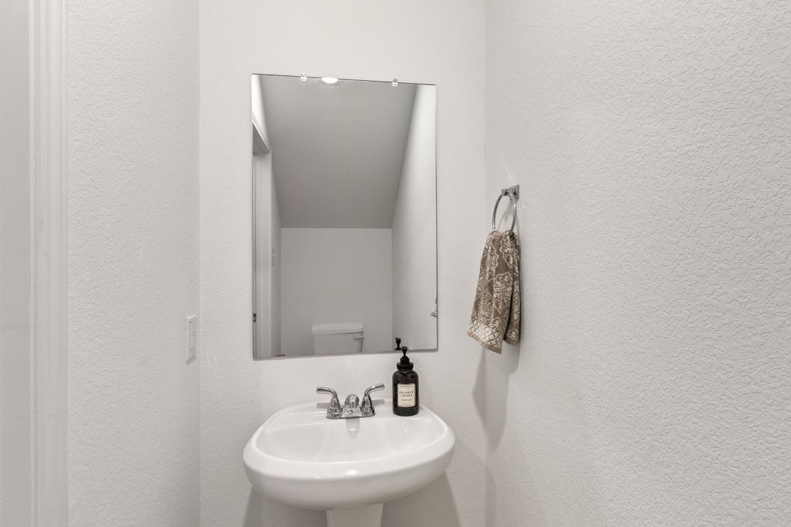 615 Backstays Loop Kyle, TX 78640 - Photo 13 of 36 a bathroom with a sink and mirror