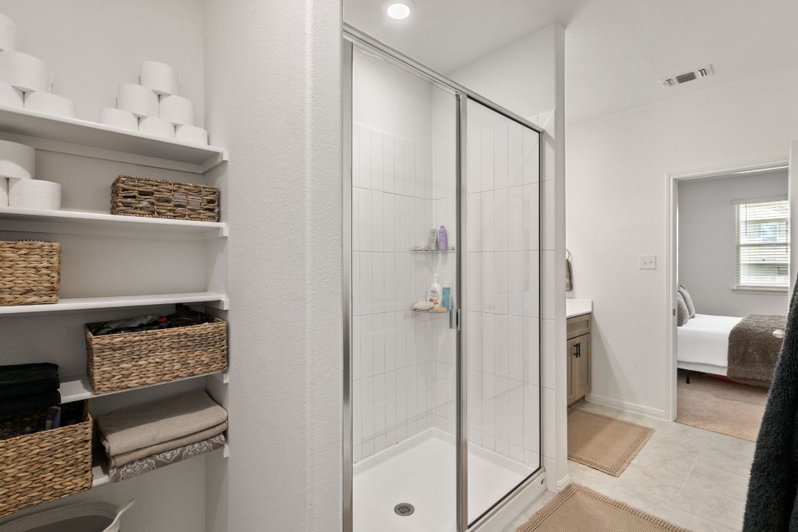 615 Backstays Loop Kyle, TX 78640 - Photo 17 of 36 a walk in closet with view of bathroom